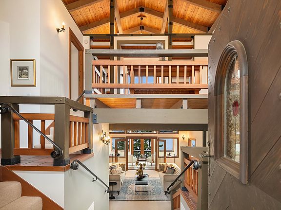 Beautiful custom mill / woodwork, attention to detail and top quality construction attract your immediate attention upon entering this home, until you find yourself totally captivated by the coveted, 180 degree unobstructed westerly Lake, city, mountain and sunset views from every main living space in this treasured home.