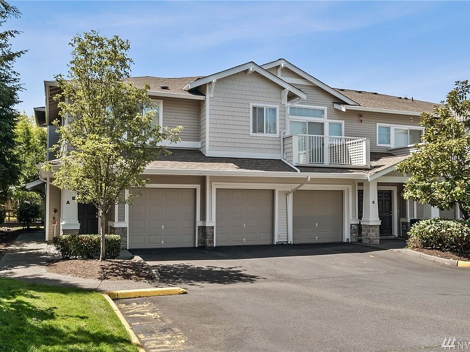Amazing condo that lives like a town home. It is the Left garage and entry door. No neighbors on one side!