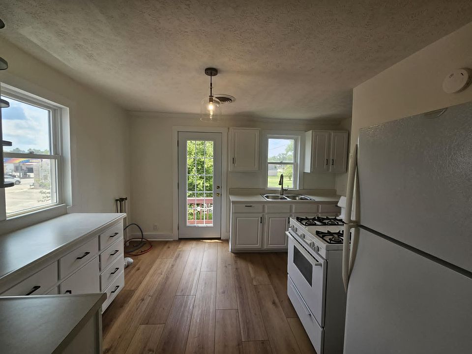 Kitchen, looking towards second entrance on the back side of the apartment