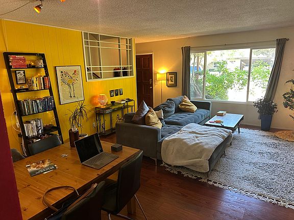 living room - walls being repainted, popcorn ceiling removed and recessed lighting installed