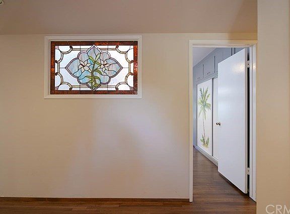 Stained glass window brings in light to the entry