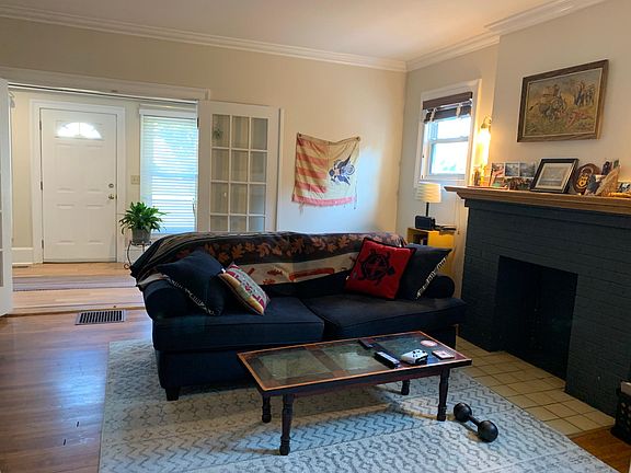 Living room looking towards front door and sunroom.