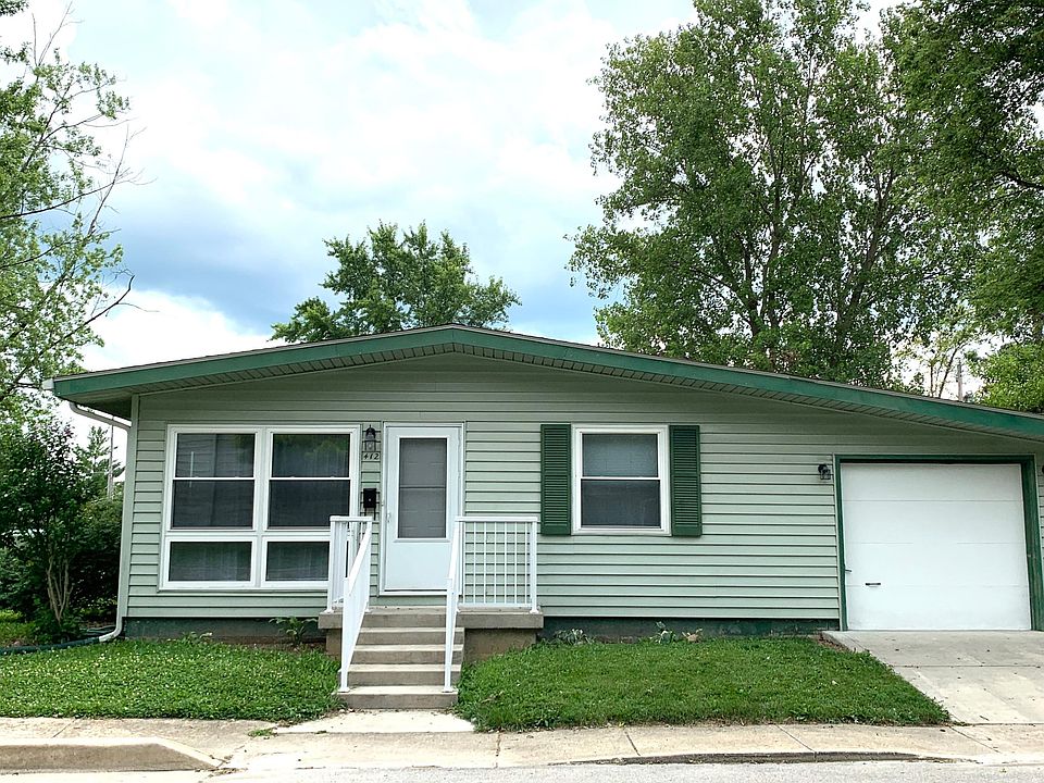 This cozy Fortville house has tons of light, great yard and lots of storage.