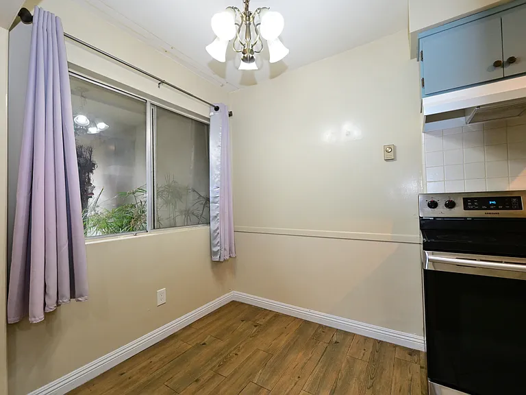 Updated kitchen with quartz countertop, SS appliances.