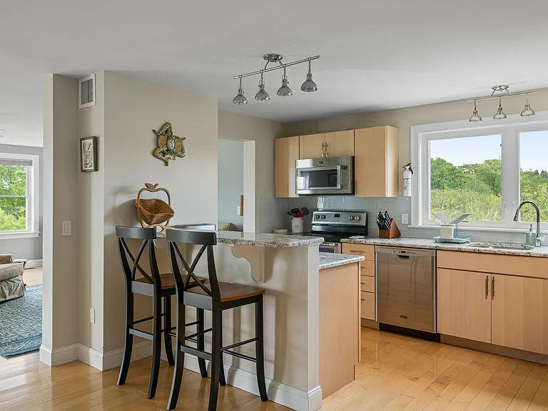 the kitchen and the open plan dining room