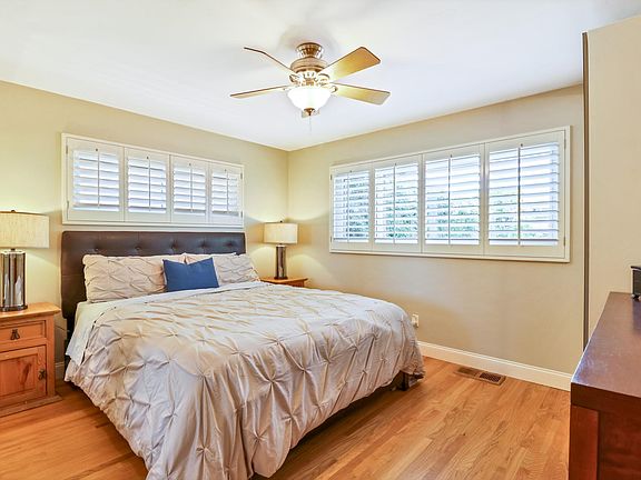 Main bedroom comfortably fits a king size bedroom set, includes two closets, and custom-made wood shutters.