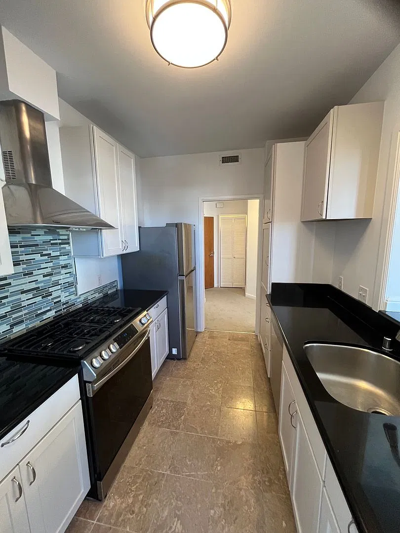 Bright, Updated Condo with In-Unit Laundry, Dual Balconies & Parking — Photo 3