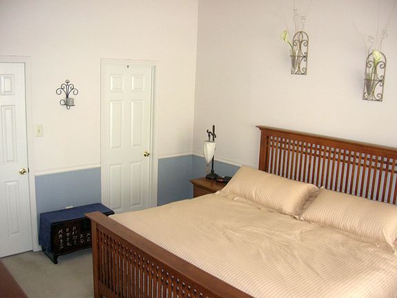 Master bedroom w/ vaulted ceiling