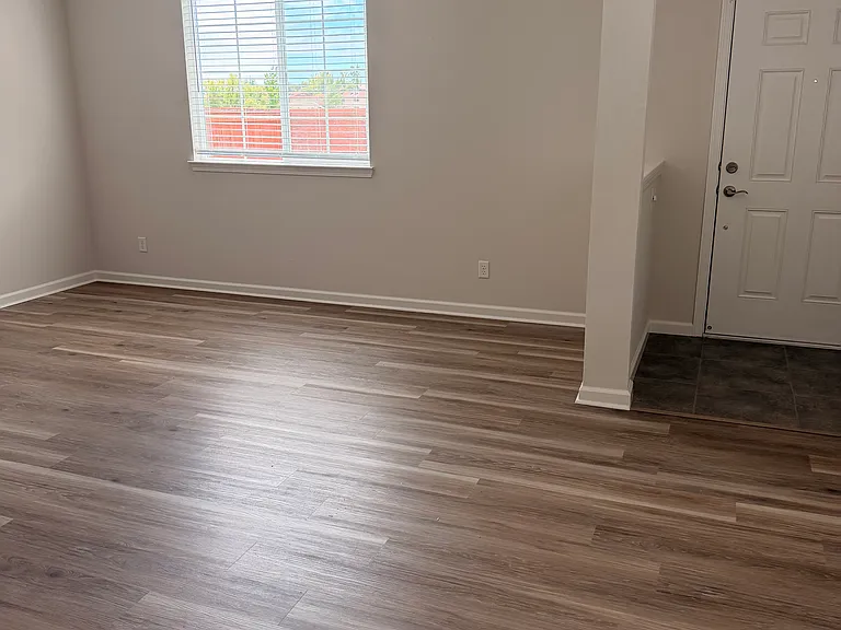 Living room with new luxury plank flooring.