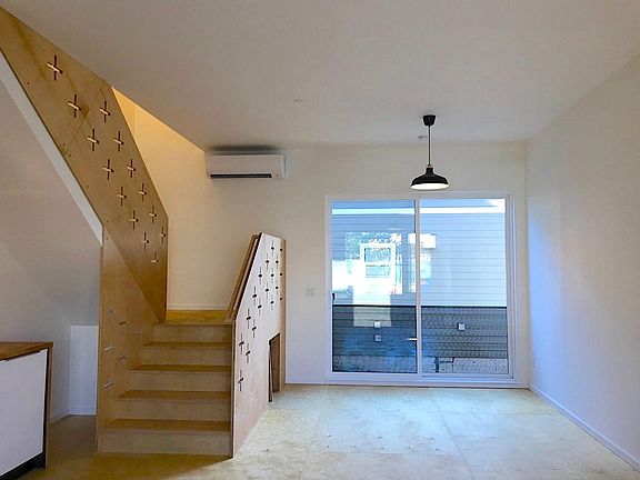 8' x 8' sliding patio door with Juliet balcony, storage nook below stairs