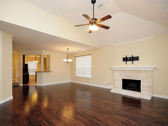 The family room is next to the dining room, and the kitchen is just past this.