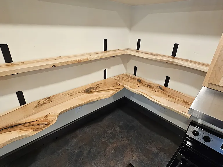 Raw Maple shelves repurposed from the Maple trees that stood on the property