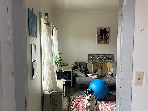 Looking into the living room from the main entry way. Stairs to the right out of frame.
Currently in the process of repainting the appartment so walls and trim are looking fresh!