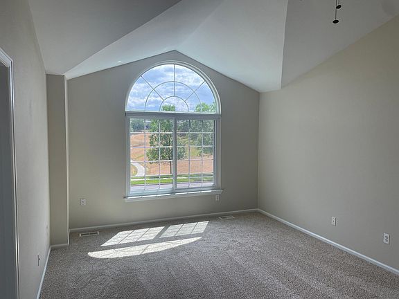 Master bedroom with ceiling fan and great views to the SW over Coyote Ridge open space and trails