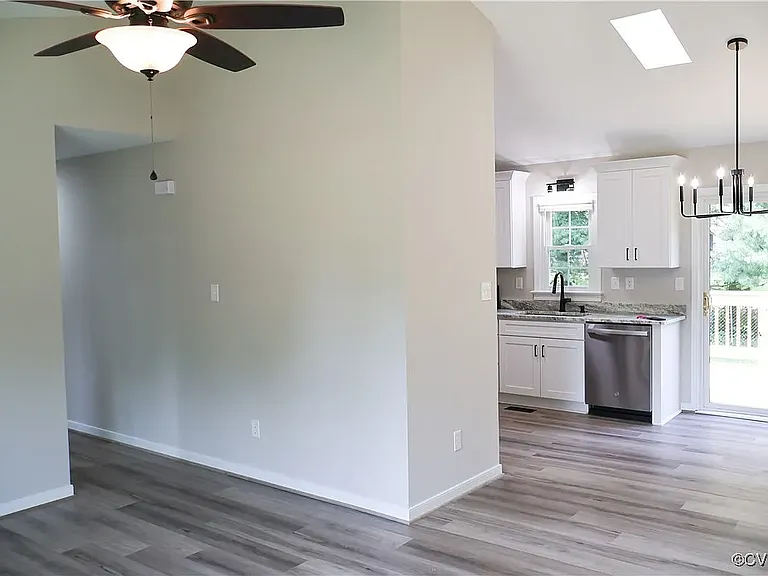 Living room open into dining area and kitchen