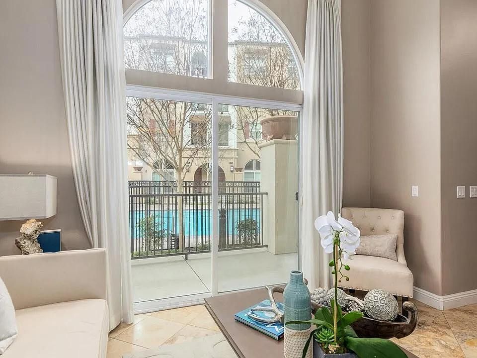Living Room with Balcony and Door to the Pool