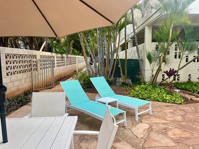 Plenty of space to lounge or dine poolside.