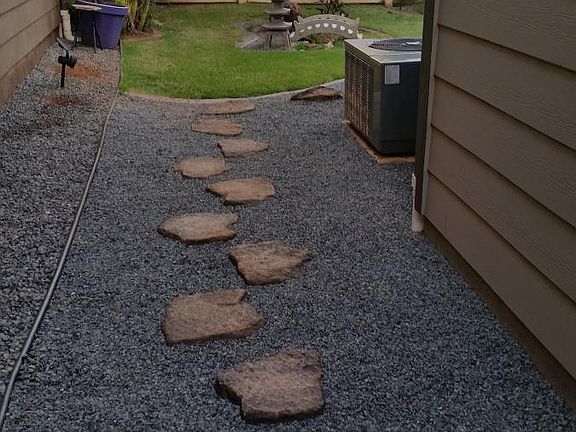 Rock garden leads to backyard