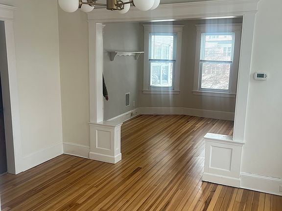Dining room in forefront and living room