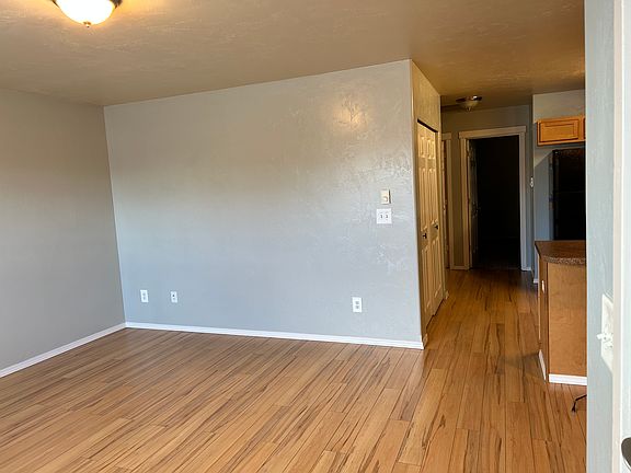 Living room area showing opening space to kitchen.
