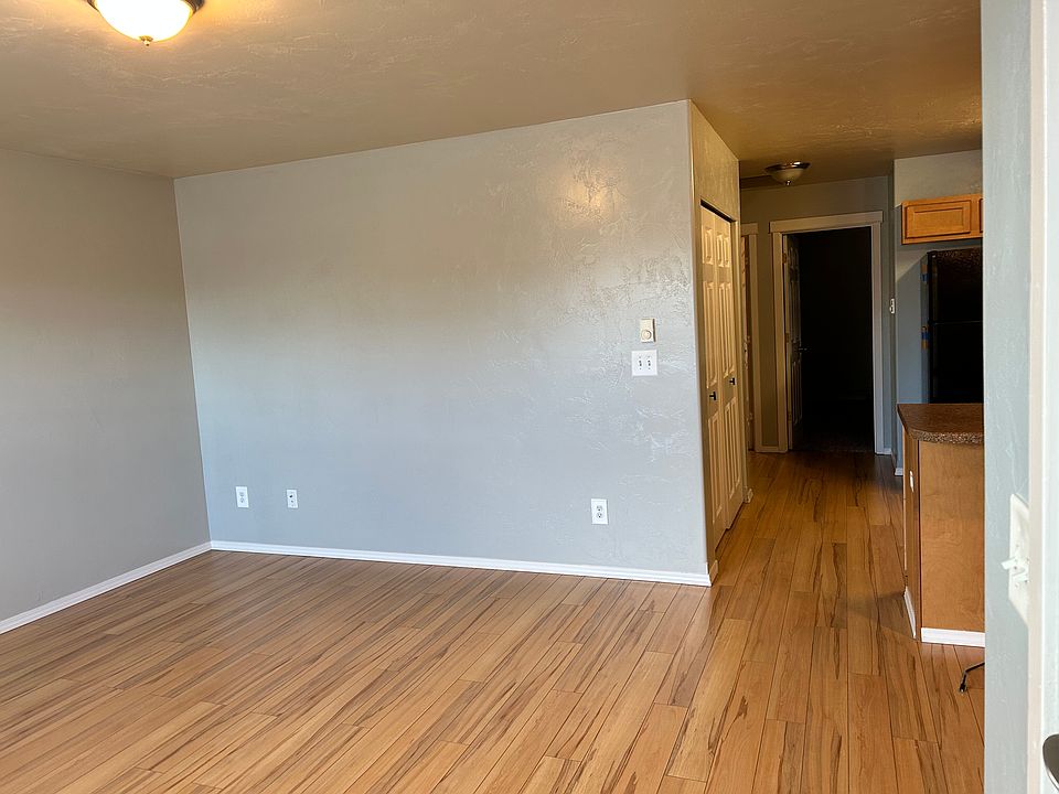 Living room area showing opening space to kitchen.