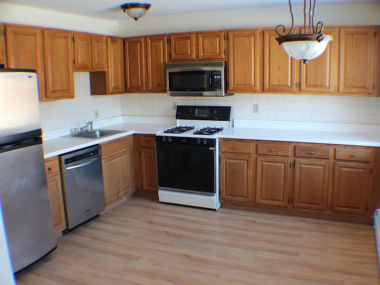 New Stove is Stainless Steel (Old Picture shown)
