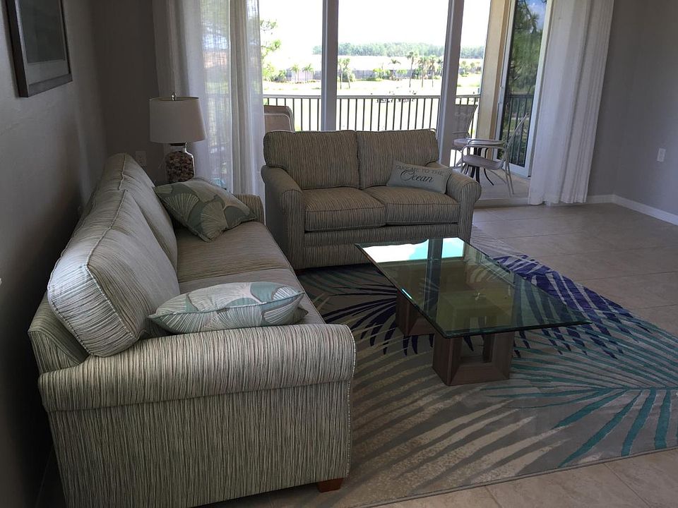 Living Room with view of Lanai and Golf course