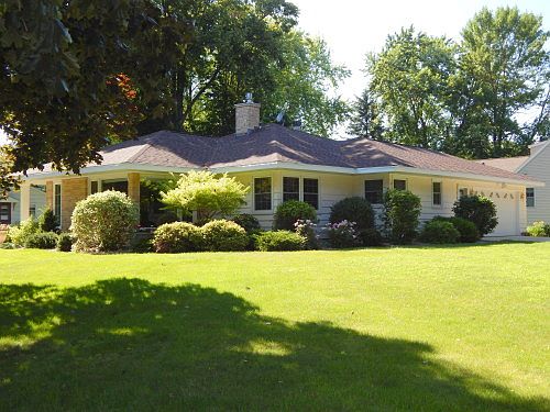 Elegant home and look at the curb appeal!! Wonderful landscaping and large windows allows every day a great day!!