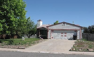 Front with mature shade trees
