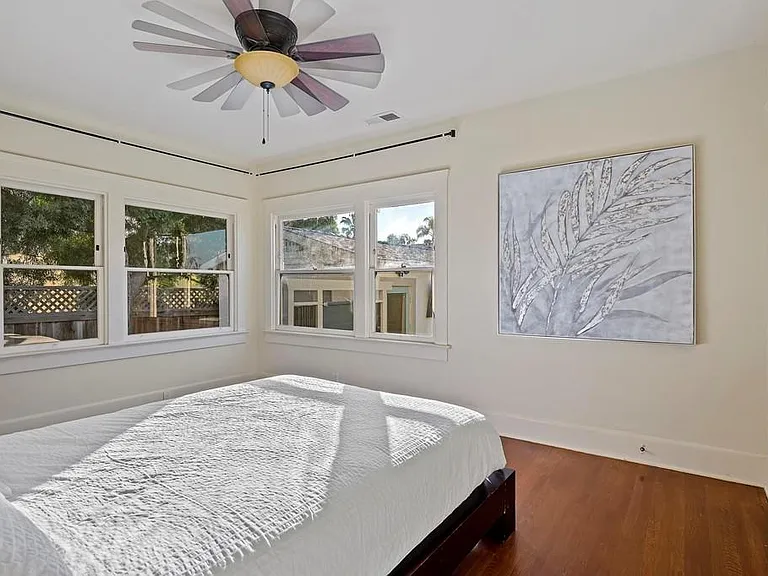 The cozy master bedroom's windows face South and West