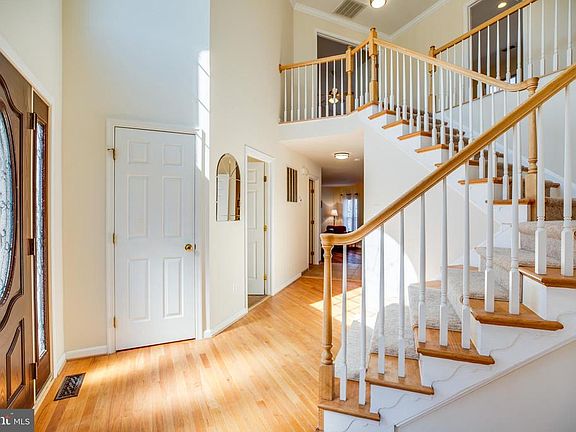 Fantastic two-story foyer with beautiful hardwoods