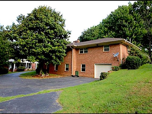 Back of home/entrance to daylight basement and garage.