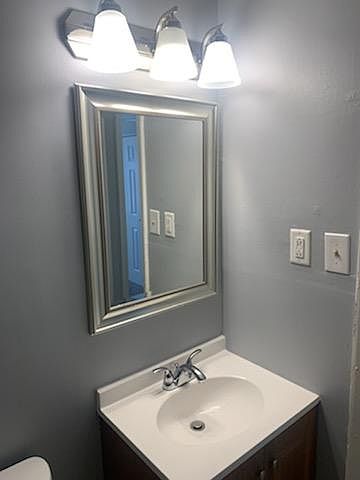 Newly Renovated Bathroom with Picture Frame Mirror