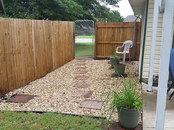 1 of 2 patios in backyard 