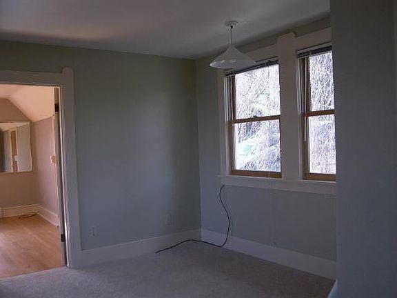 Space for dining table at east end of living room on 2nd floor.