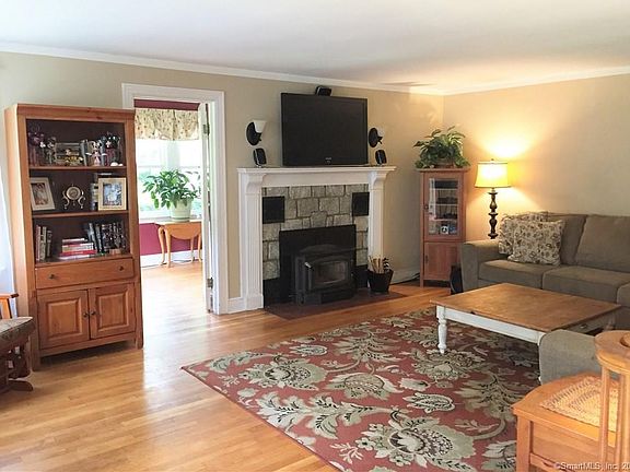 Large Living Room-Oak hardwood floors-Stone surround wood stove