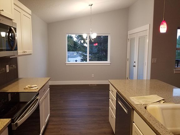 The dining area off the kitchen. French doors lead to the backyard patio.