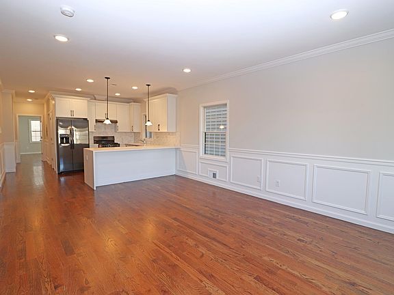 OPEN CONCEPT LIVING WITH PICTURE FRAME MOLDINGS