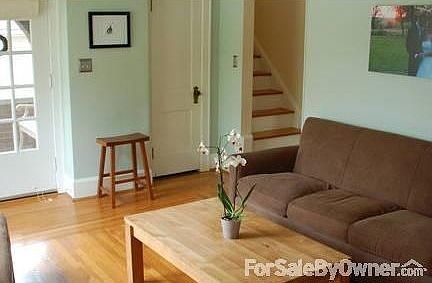 Family Room
						:
						Looking back to front porch, coat closet and stairs leading to second floor.
