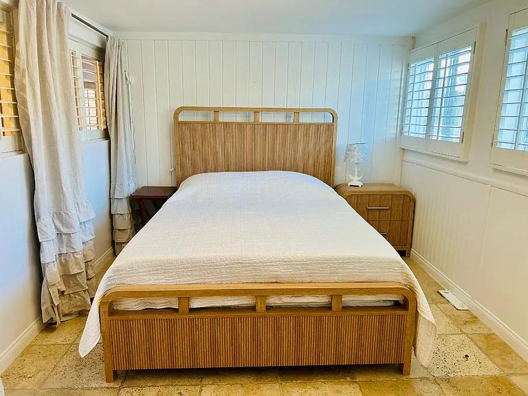 Queen-sized bed set-up in the guest room