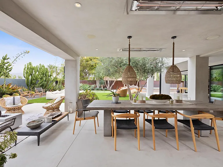 The open outdoor space features a classic beach chic design.