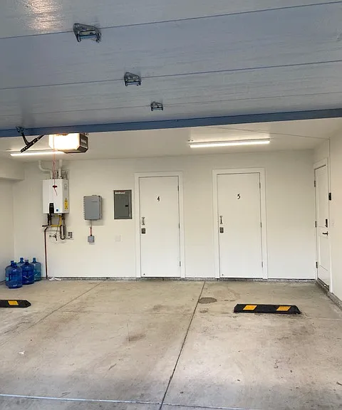 Tenant has use of half of a 2 car gargage with their own storage space. Other half is used by another tenant.