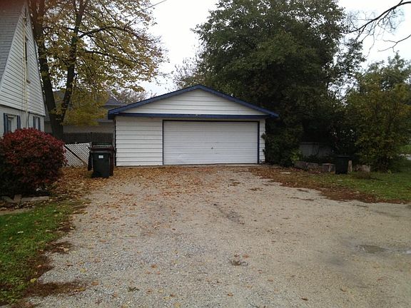 Huge 2-1/2 car garage with plywood storage in rafters.