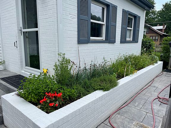 Raised bed flower/ herb garden in front and back