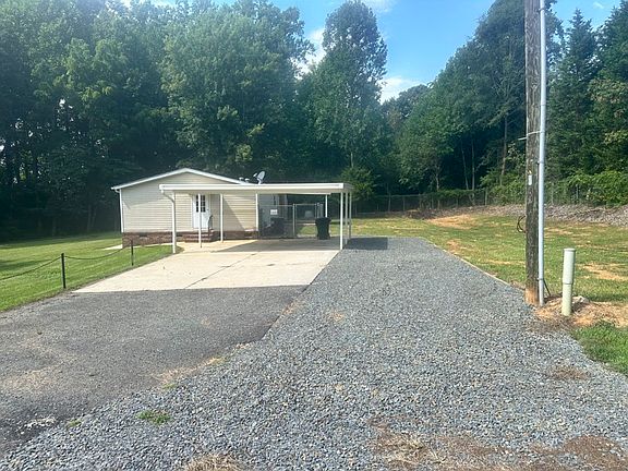 2-car carport with additional Parking spaces