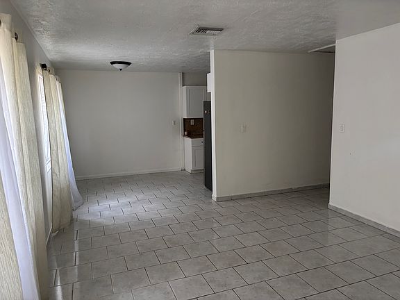 entry way, living room, dining room.