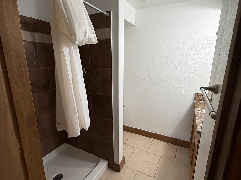 1st floor private bathroom w/ shower vanity and toilet