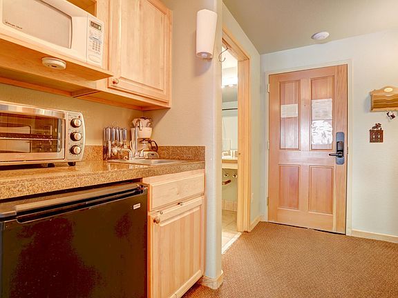 Efficiency Kitchen. Microwave, small fridge and toaster oven