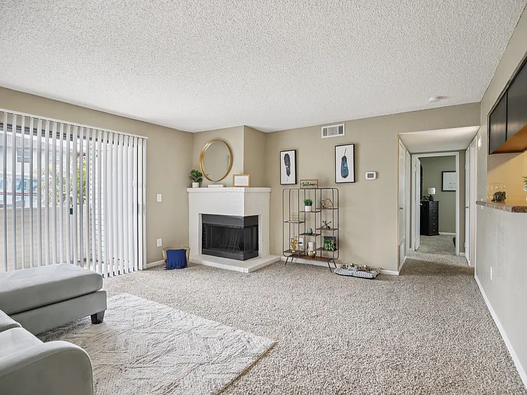 Living area with wood-burning fireplace.