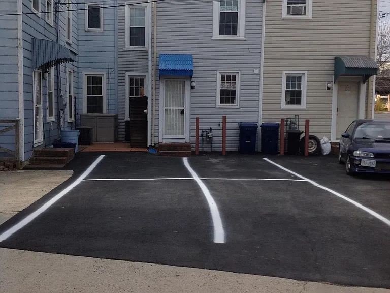 Rear of property w 4 private parking spaces